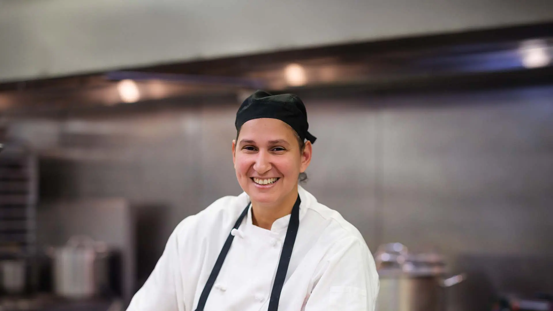 Chef smiling in kitchen